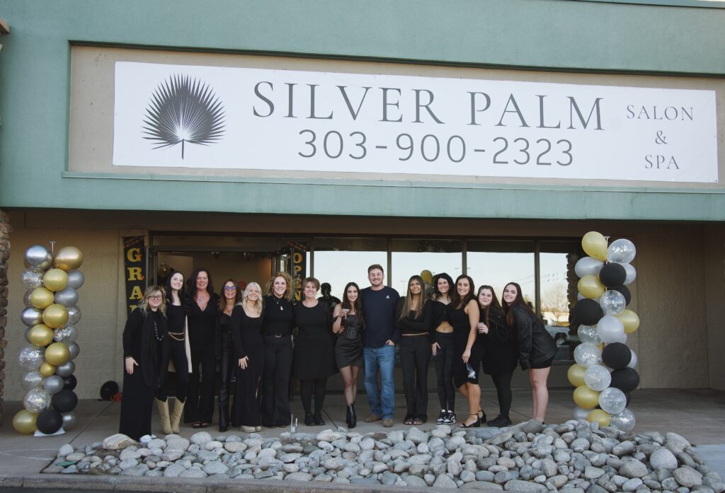 The expert team at the best salon and spa in Littleton, CO—Silver Palm Salon & Spa—outside the salon entrance.